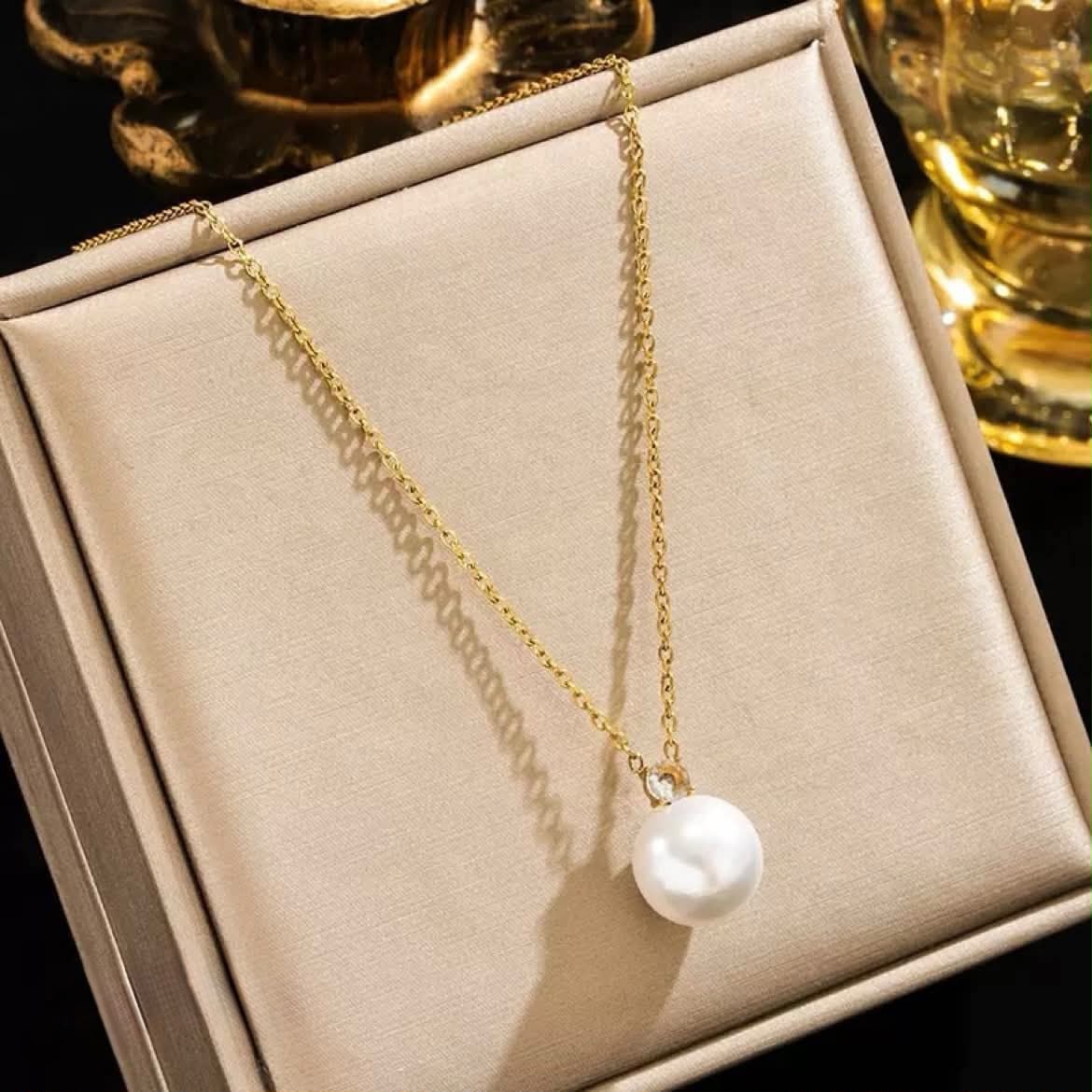Golden pendent with locket