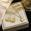 Golden pendent with pearl and earring with pearl set