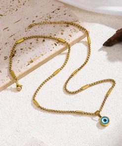 golden pendent with evil eye catcher locket