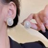 white pearl earring